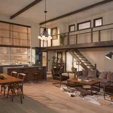 Open plan living room and kitchen with Lutron motorized shades filtering the light entering the room.