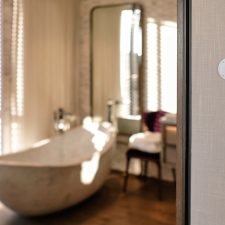 Josh Nano voice-control microphone installed in a modern bathroom